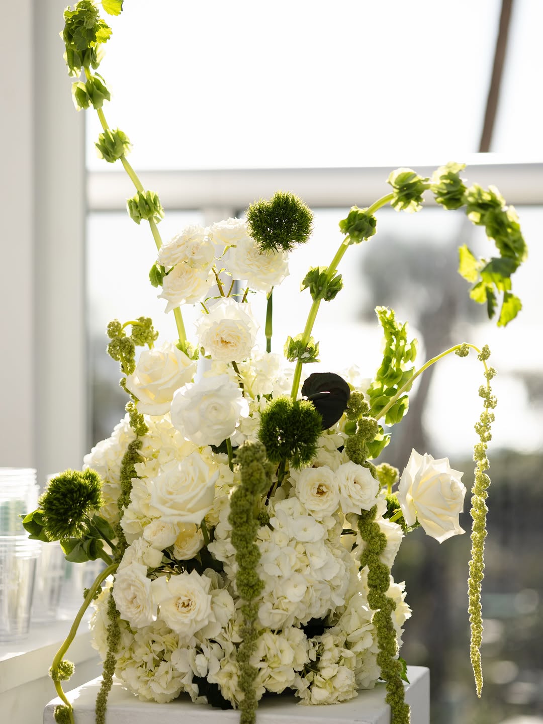 Large floral arrangements on pedestals
